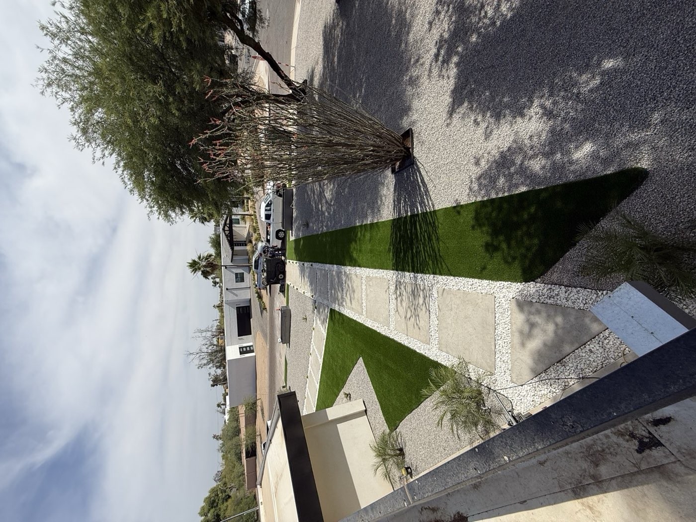 Geometric turf and paver walkway design