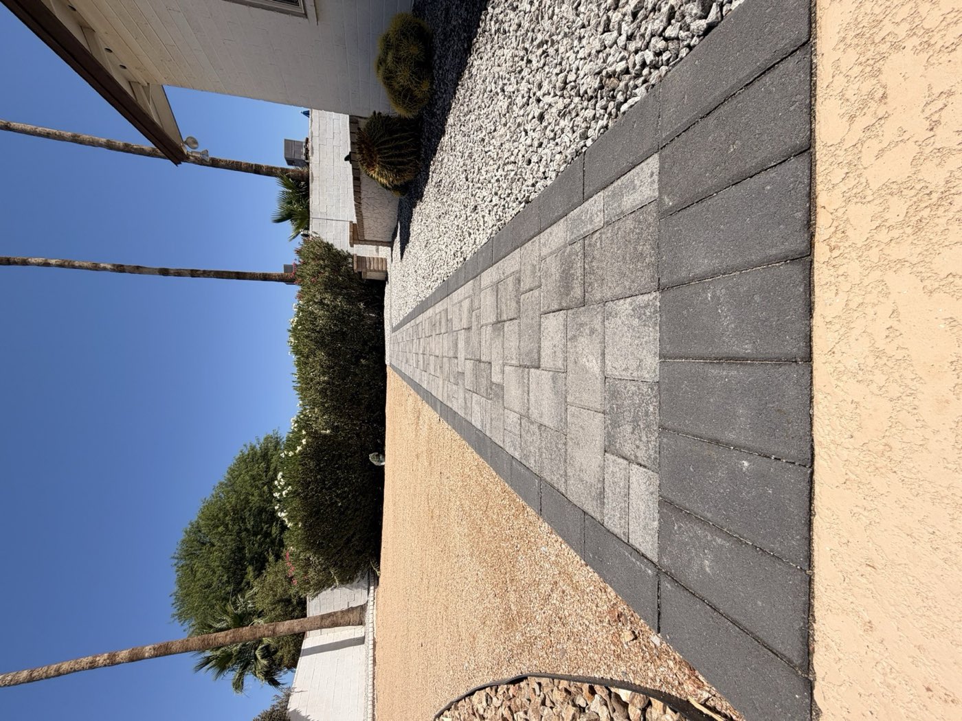 Charcoal-bordered paver entry walkway